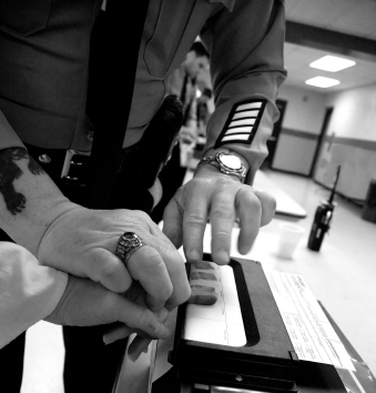 arrestee giving fingerprints before calling a criminal defense lawyer