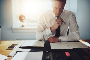 criminal defense attorney examining evidence