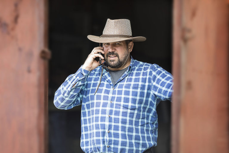 cowboy on cell phone with criminal attorney