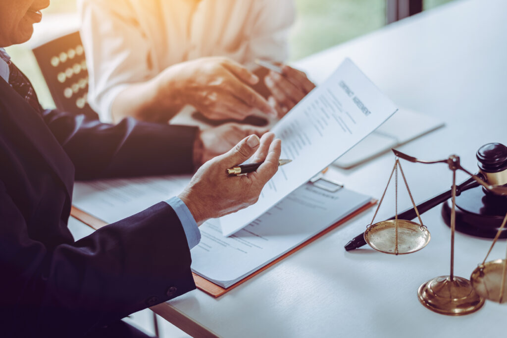 lawyers-discussing-sign-contract.jpeg